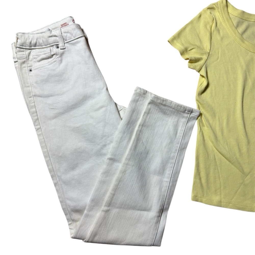 Kids all white jeans with yellow top. Art class shirt and jeans are cat and jack